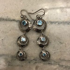 Sterling silver earrings with blue topaz gems